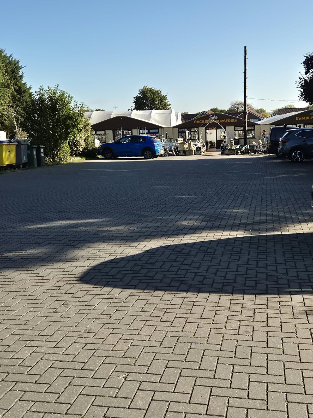The free block-paved car park at Orchard Nurseries