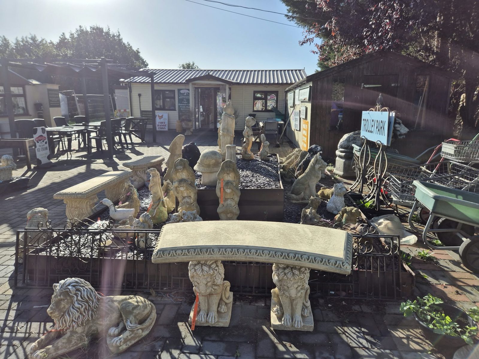 Stoneware ornaments and benches at Orchard Nurseries