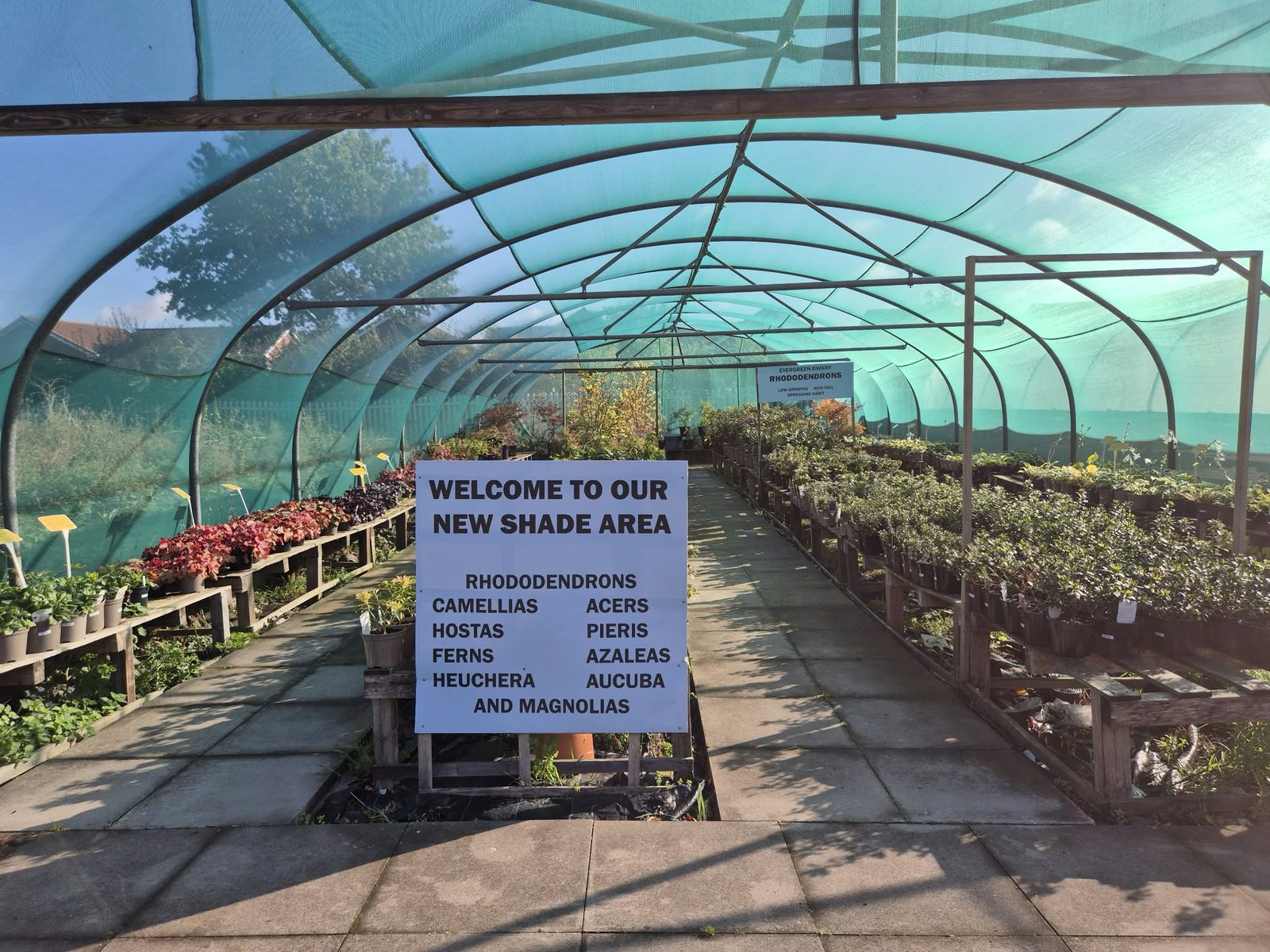 The welcome sign at the shade area of Orchard Nurseries