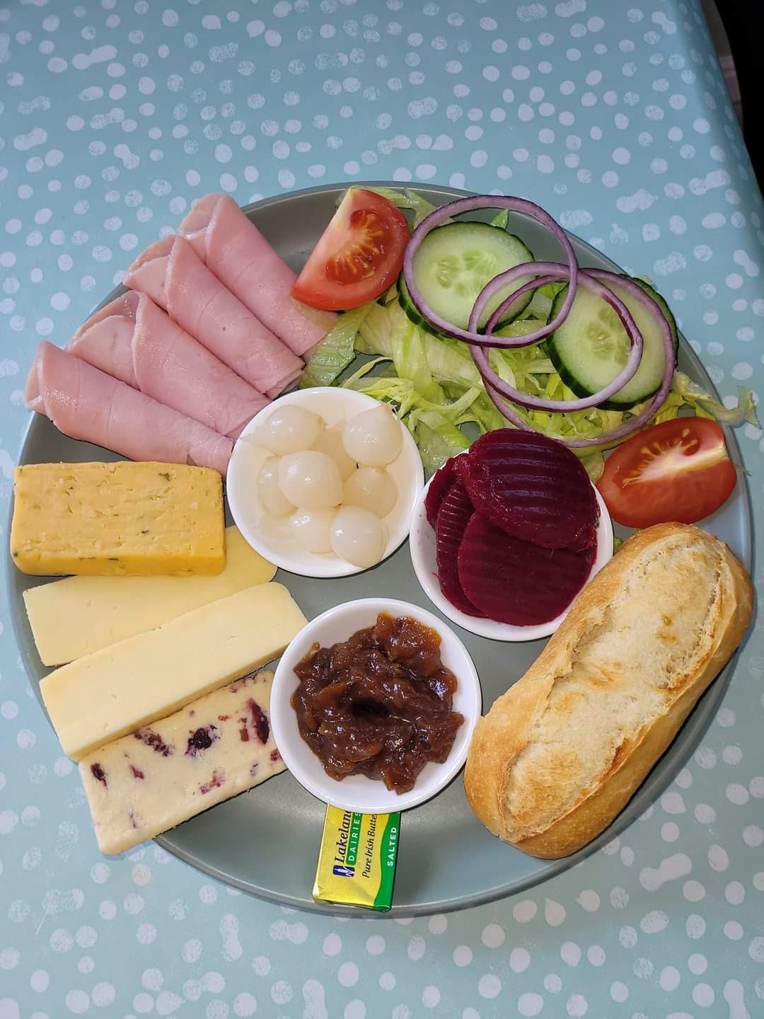 Ploughman's lunch with ham, cheese and pickles