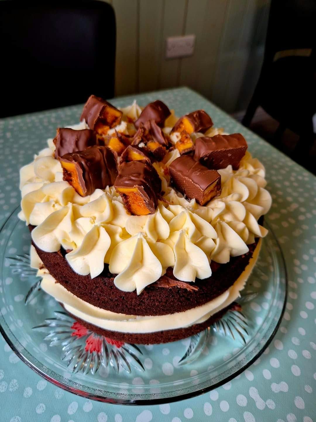 Celebration cake topped with honeycomb pieces